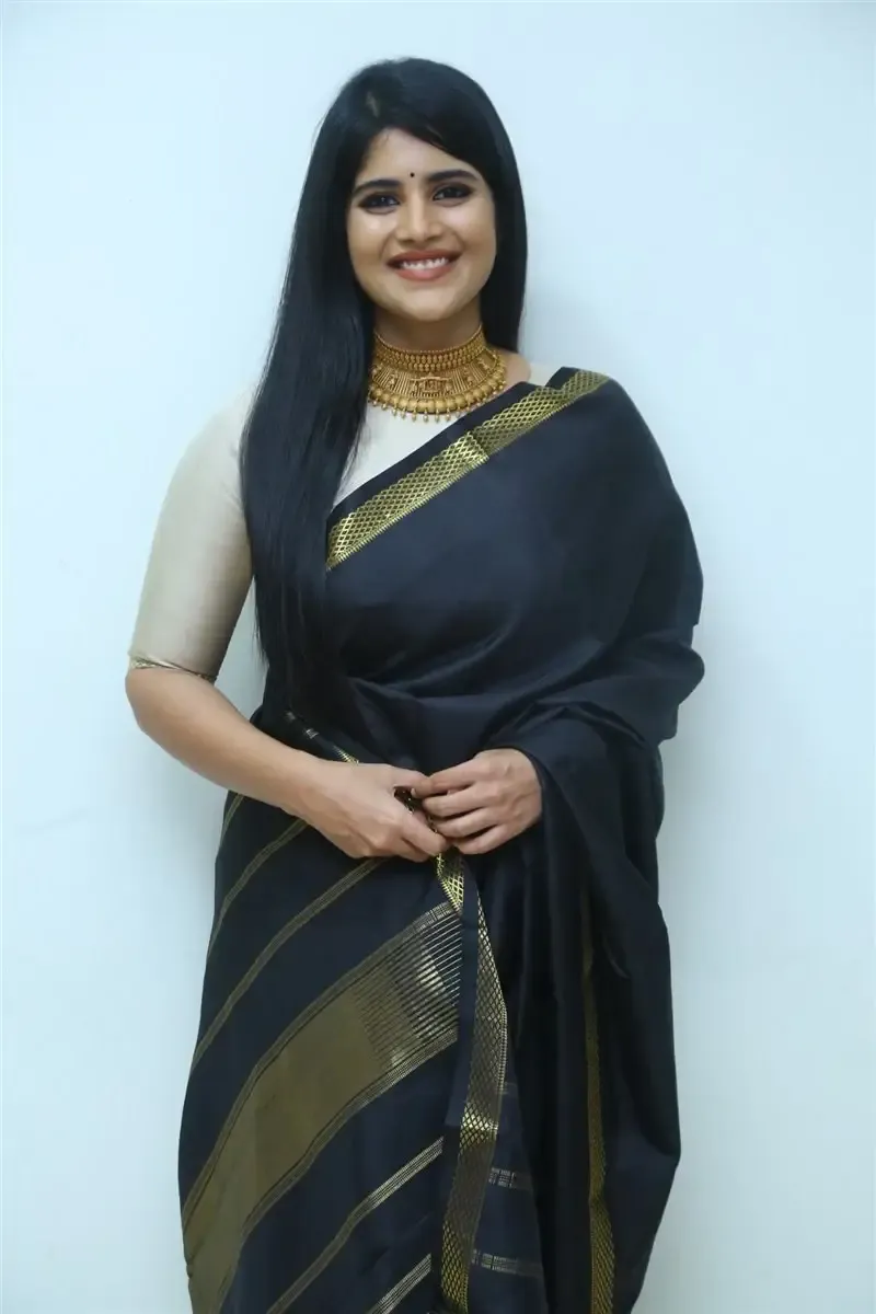 Megha Akash in Black Saree at Manu Charitra Telugu Movie Trailer Launch